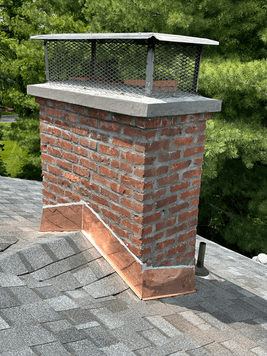 aerial view of a modern home with a stylish roof in New York showcasing gray shingles and landscaped yard