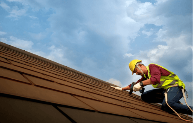 commercial roofing expert repairing roof