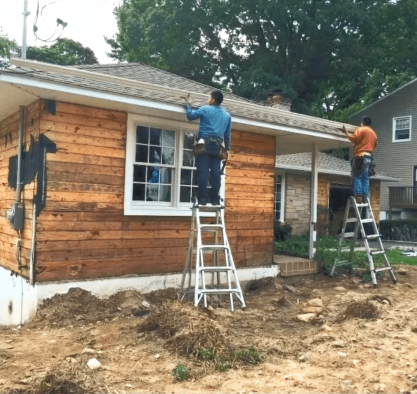Gutters installed on a residential roof, showcasing effective rainwater drainage and home exterior protection in New York.