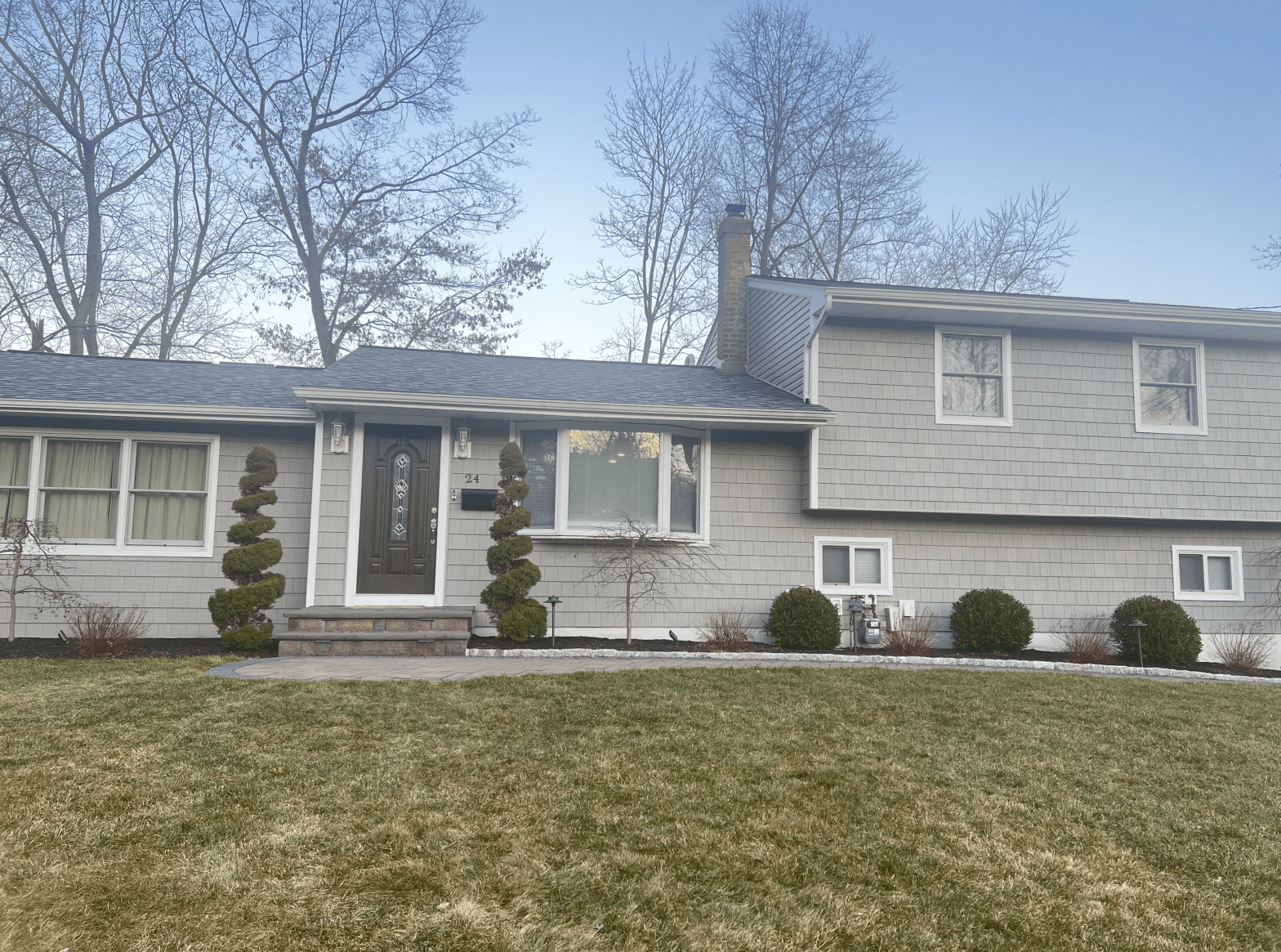 New siding installation on a residential home in New York, showcasing modern design and durability.