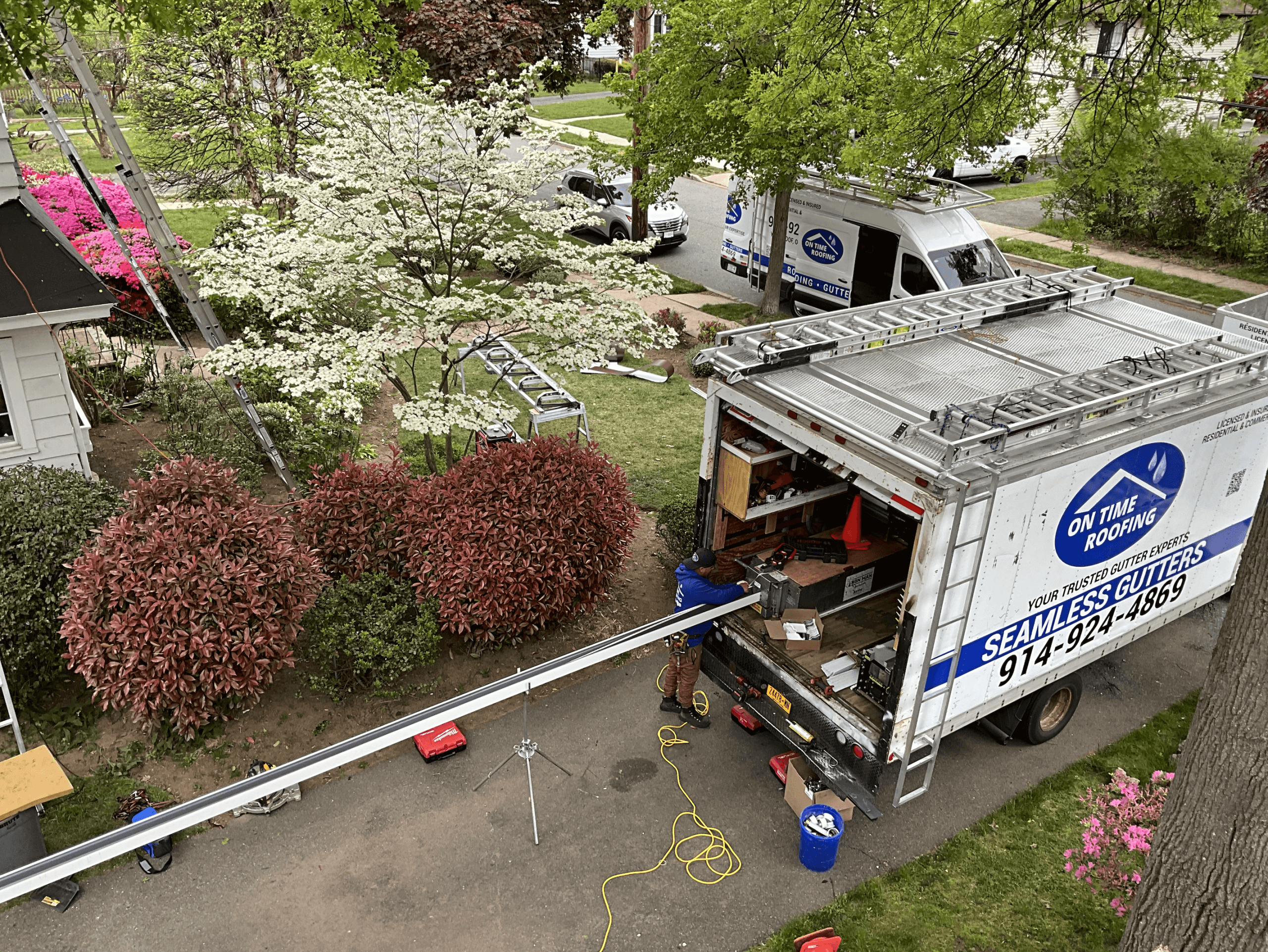 Fabricating seamless gutters at On Time Roofing in New York, showcasing craftsmanship and quality construction.