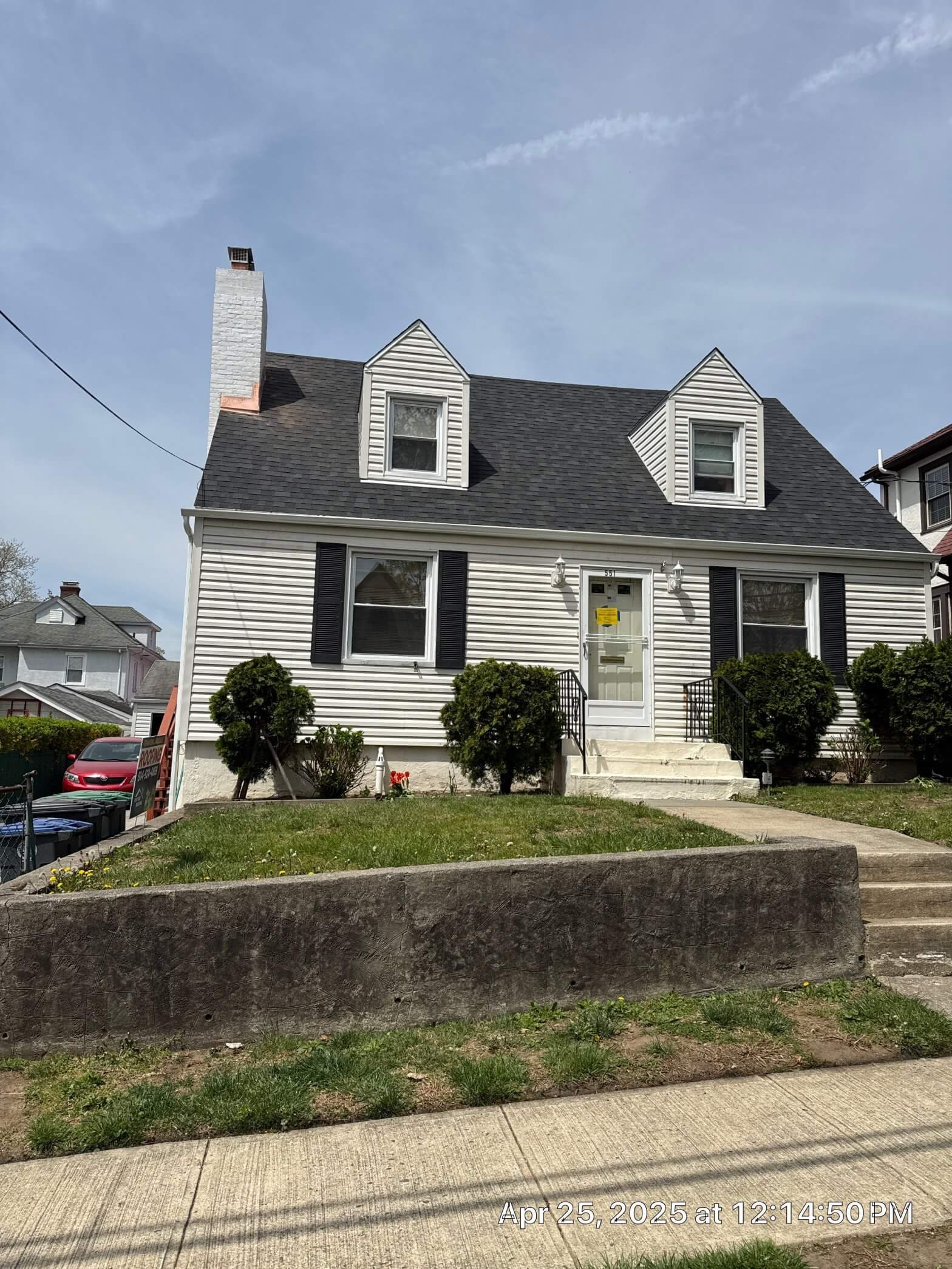 New residential roofing installation showcasing modern shingles and a clear blue sky in New York.