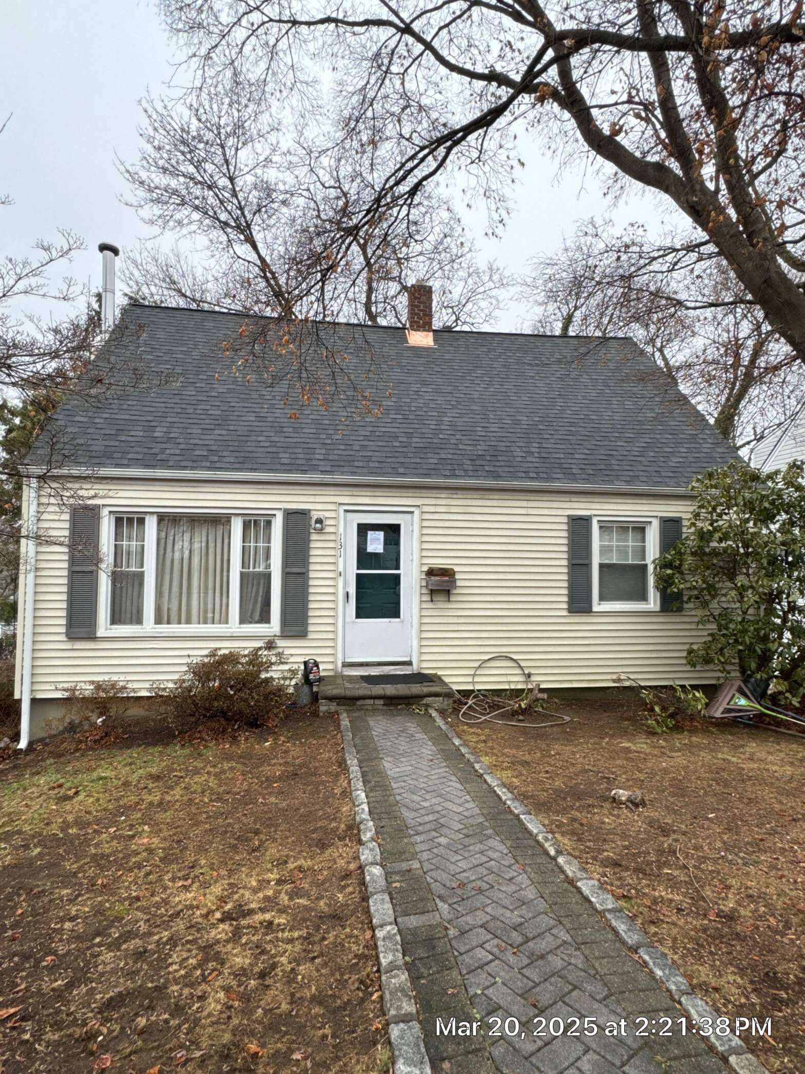 Newly installed black shingle roof on a residential home, showcasing quality craftsmanship and modern design in New York.