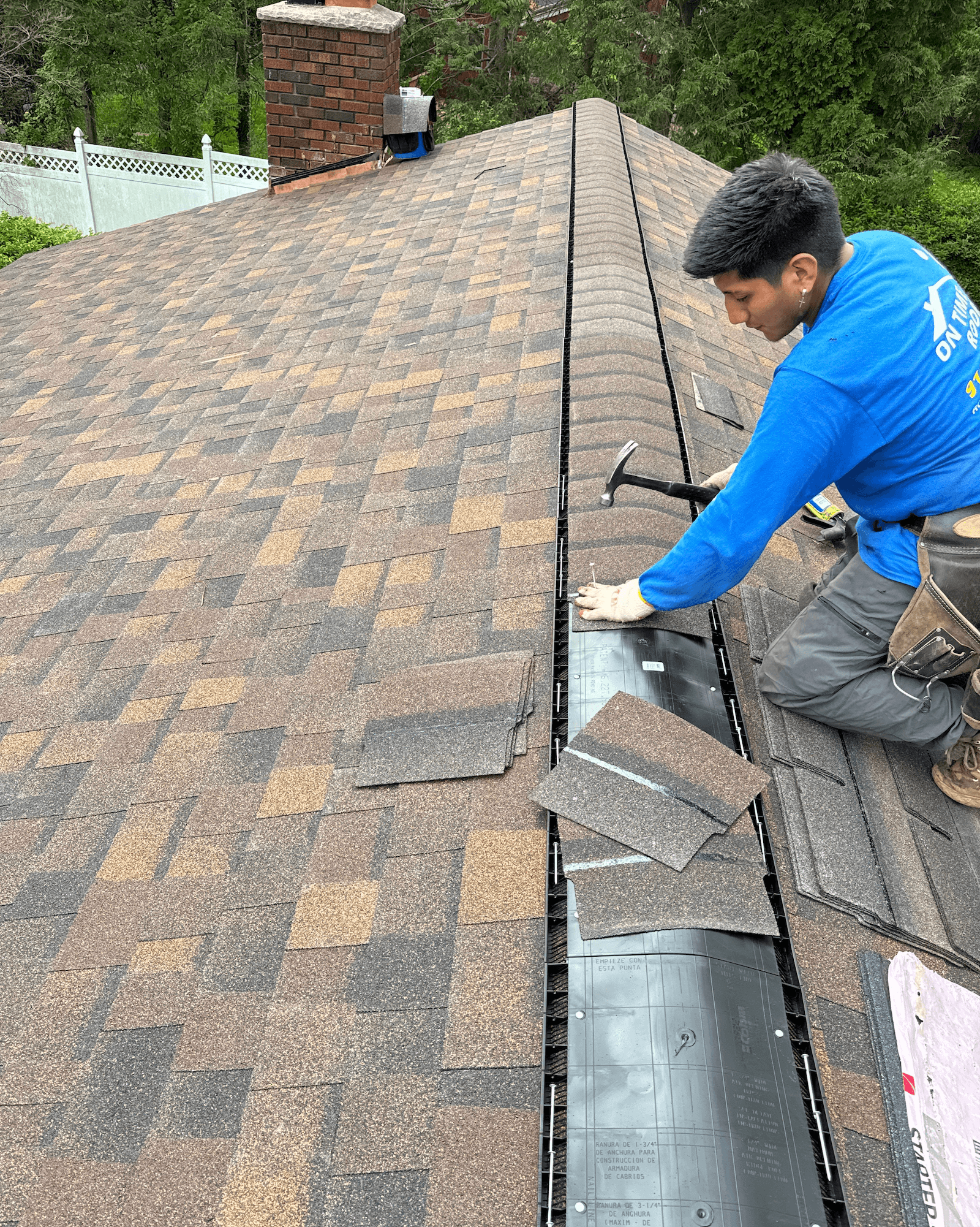 Roofing construction in progress showing workers on a residential building in Westchester County NY
